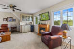 This inviting living space features a cozy fireplace, perfect for relaxing evenings.