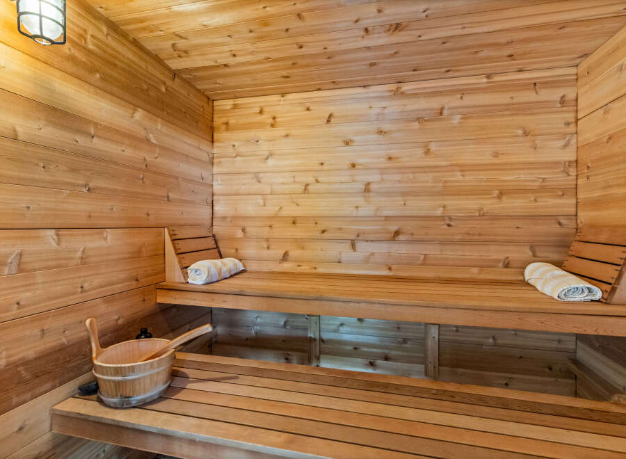 Experience ultimate relaxation in this beautifully crafted wooden sauna.
