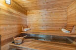 Experience ultimate relaxation in this beautifully crafted wooden sauna.