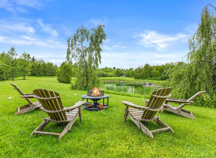 Enjoy the serene outdoors with this inviting fire pit area, perfect for gathering with loved ones.