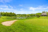 Experience luxury living with this stunning property featuring a private pond and lush green golf course views.