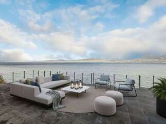 Experience luxurious outdoor living with this stunning patio featuring a sectional sofa, comfortable armchairs, and a modern coffee table.