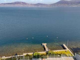Experience waterfront living with this stunning property featuring a private dock on a crystal-clear lake.