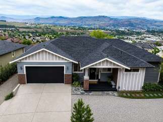 Experience breathtaking panoramic views from this stunning modern home, perfectly situated to capture the expansive valley and mountain vistas.