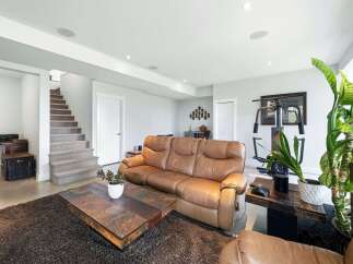 Discover this spacious basement living area, perfect for relaxation and entertainment.