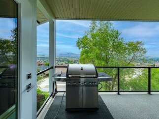 Enjoy breathtaking panoramic views from this stunning balcony, perfect for entertaining or relaxing.