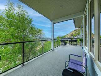 Enjoy breathtaking views from this spacious balcony, perfect for outdoor entertaining or quiet relaxation.