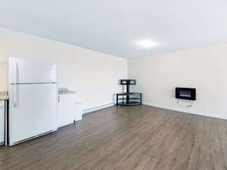 Discover this charming living space featuring a modern electric fireplace perfect for cozy evenings.