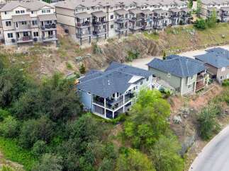 Discover modern living in this stunning multi-level home, perfectly situated on a hillside with breathtaking views.