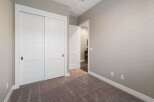 Step into this inviting room featuring a spacious closet with sleek sliding doors, perfect for ample storage.