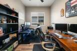 This home office features two distinct workstations, perfect for productivity or gaming.