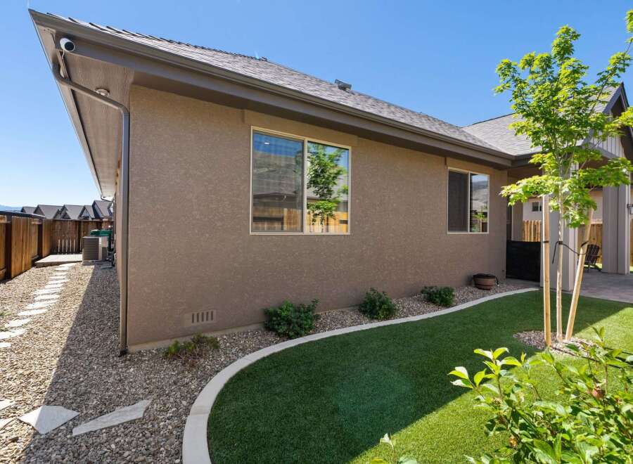 Discover this charming home featuring a well-maintained exterior with a stucco finish and a durable asphalt shingle roof.