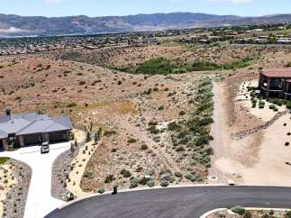 Discover this stunning property offering breathtaking panoramic views of the surrounding mountains and valley.