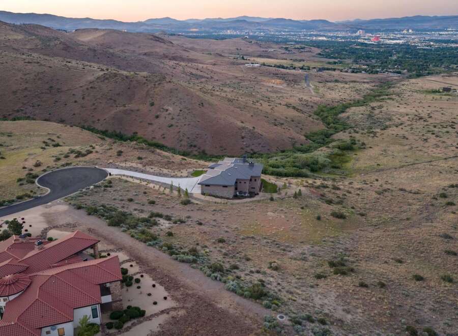 Experience luxury living in this stunning custom-built estate, nestled amidst rolling hills with panoramic city views.