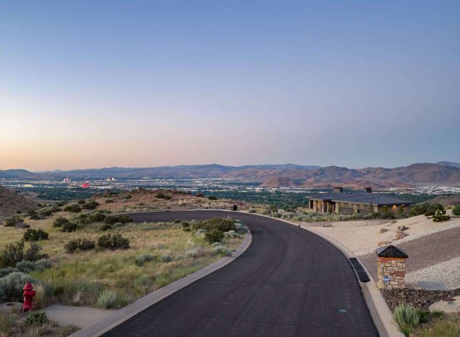 Experience breathtaking panoramic views from this stunning luxury estate, perched high above the city lights.