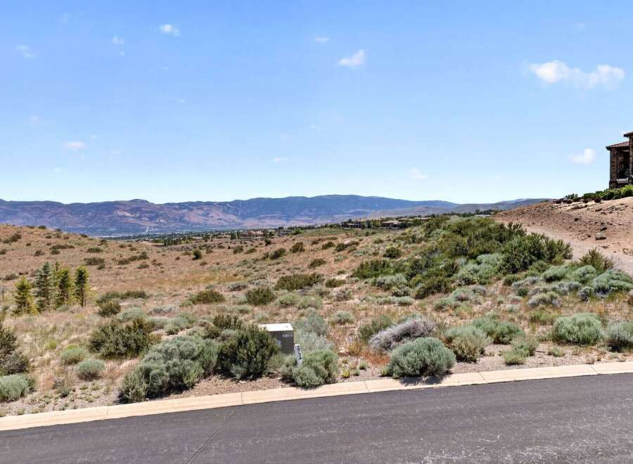 Discover breathtaking panoramic views from this elevated lot, perfect for building your dream home.