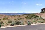 Discover breathtaking panoramic views from this elevated lot, perfect for building your dream home.