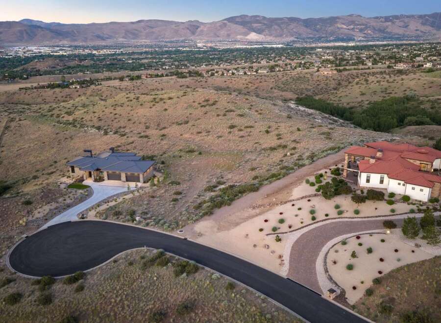 Experience luxury living in this stunning estate, perched on a hillside with panoramic views of the valley and mountains.