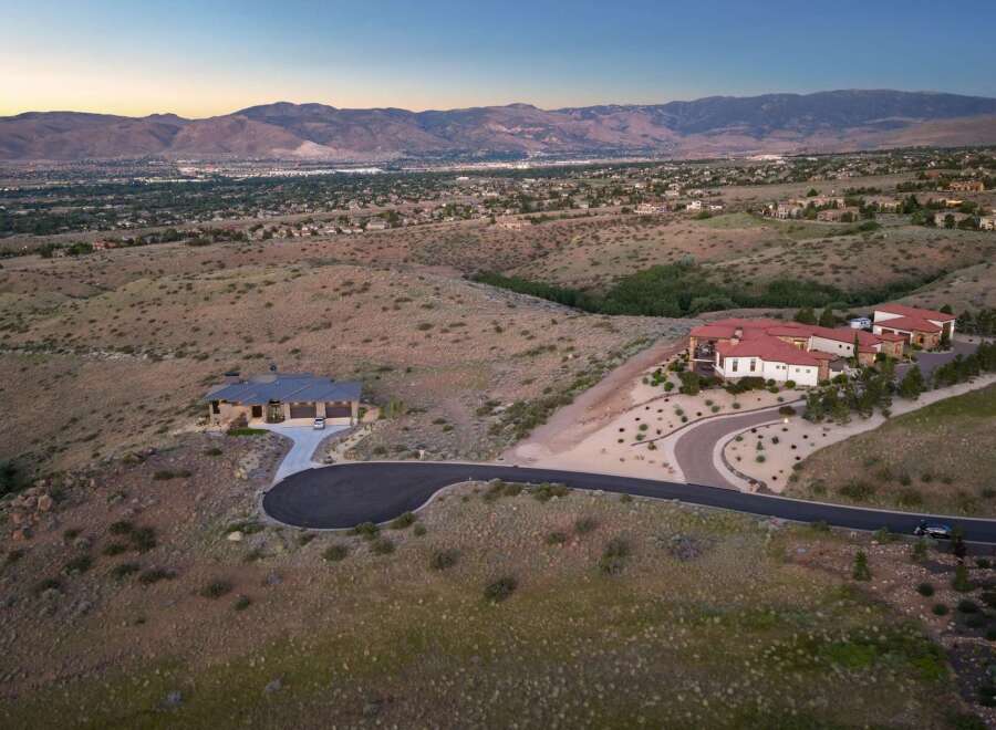 Discover luxury living with these two stunning estates nestled in a picturesque hillside setting, offering breathtaking panoramic views of the valley and mountains.