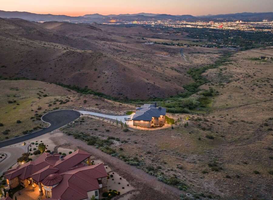 Experience luxury living in this stunning custom-built estate, nestled amidst rolling hills with panoramic city views.