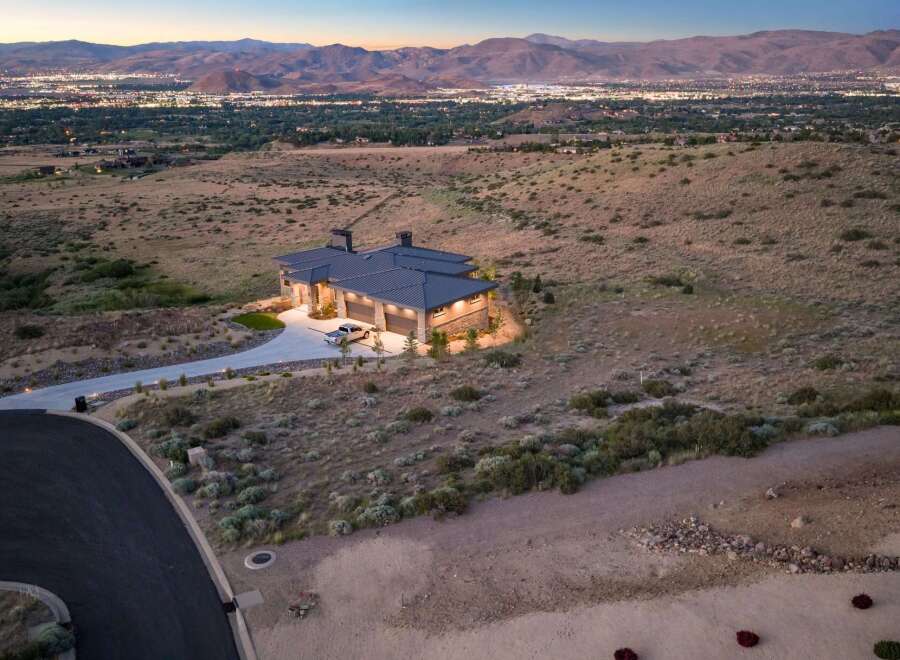 Experience luxury living with this stunning modern home, perfectly situated to capture breathtaking panoramic views of the city lights and surrounding mountains.