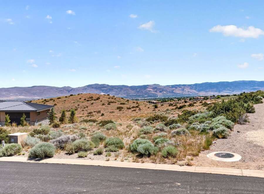 Discover breathtaking panoramic views from this elevated lot, perfect for building your dream home.