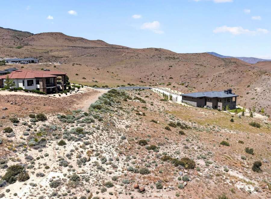 Discover luxury living in this stunning modern home nestled in a serene, arid landscape.