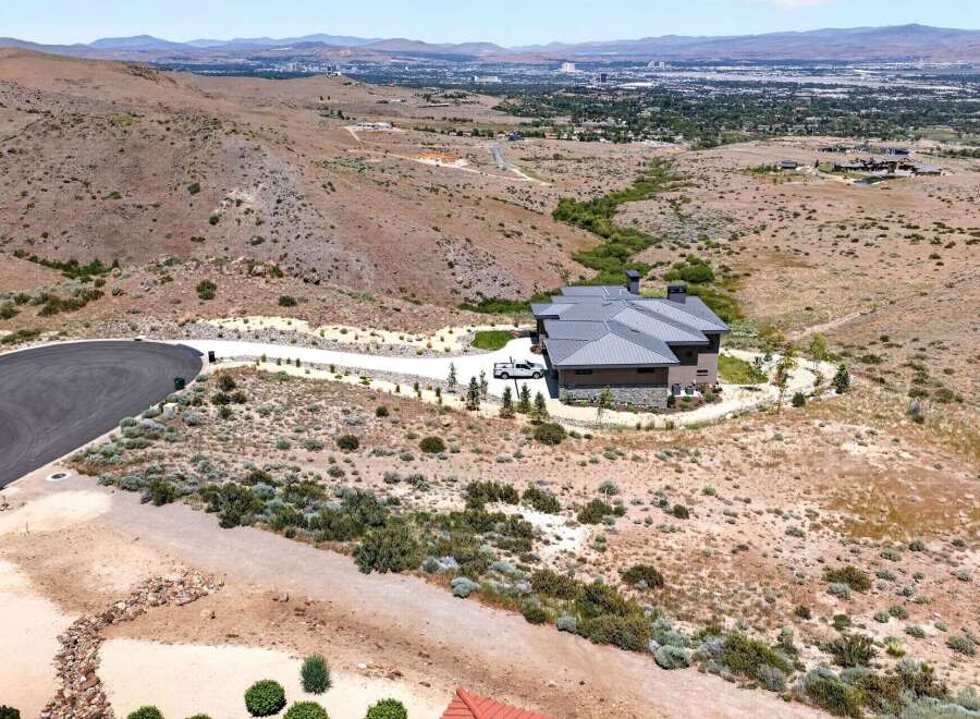 Experience luxury living in this stunning modern home, nestled in a serene, elevated landscape with panoramic city views.