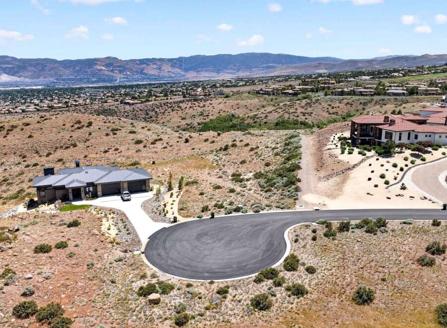 Experience luxury living in this stunning modern home, nestled in a picturesque hillside community.