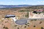 Experience luxury living in this stunning modern home, nestled in a picturesque hillside community.