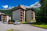 Experience mountain living in this stunning apartment complex, offering breathtaking views of snow-capped peaks and lush green valleys.