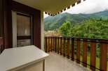 Enjoy breathtaking mountain views from this charming balcony, perfect for your morning coffee or evening relaxation.
