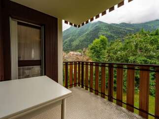 Enjoy breathtaking mountain views from this charming balcony, perfect for your morning coffee or evening relaxation.