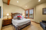 Experience rustic charm in this inviting bedroom, featuring a sturdy wooden bed frame and coordinating nightstands.