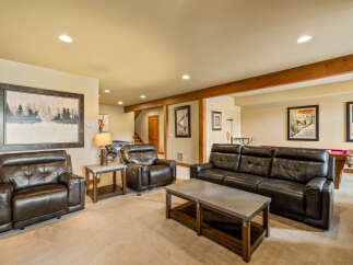 This spacious basement living area offers a comfortable and inviting atmosphere, perfect for relaxation and entertainment.