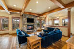 Experience rustic charm in this inviting living room, featuring a magnificent stone fireplace as the centerpiece.