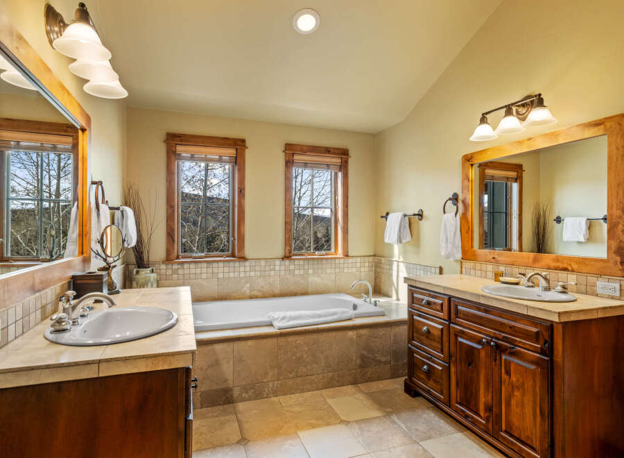Experience luxury in this spacious bathroom featuring a deep soaking tub perfect for relaxation.