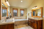 Experience luxury in this spacious bathroom featuring a deep soaking tub perfect for relaxation.