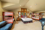 This spacious bedroom is perfect for families or groups, featuring two sturdy wooden bunk beds and a comfortable queen-size bed.