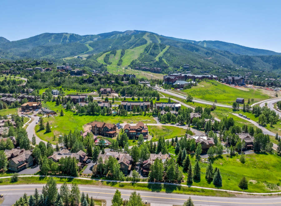 Experience luxury mountain living in this stunning property nestled amidst lush greenery and scenic mountain vistas.
