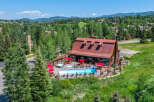 Experience luxury mountain living with this stunning property featuring a sparkling swimming pool and a relaxing hot tub, perfect for unwinding after a day of adventure.