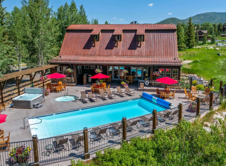 Experience luxury and relaxation at this stunning property featuring a sparkling swimming pool and a soothing hot tub, perfect for unwinding.