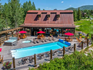 Experience luxury and relaxation at this stunning property featuring a sparkling swimming pool and a soothing hot tub, perfect for unwinding.