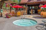 Enjoy ultimate relaxation in this inviting outdoor space, featuring a bubbling hot tub perfect for unwinding.