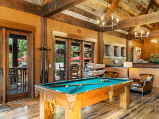 Experience ultimate relaxation and entertainment in this stunning recreational space, featuring a professional billiard table perfect for friendly games.