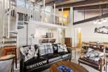 Experience modern living in this stunning loft-style condo, featuring a dramatic spiral staircase leading to a spacious loft area.