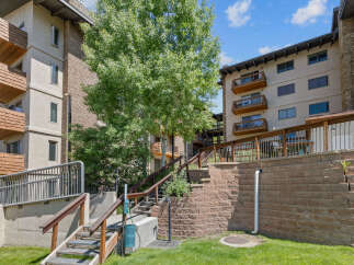 Discover this charming property featuring multiple levels of living space, each with private balconies offering scenic views.