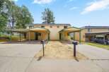 Discover comfortable living in this charming duplex featuring two distinct units, each with its own covered carport for convenient parking.