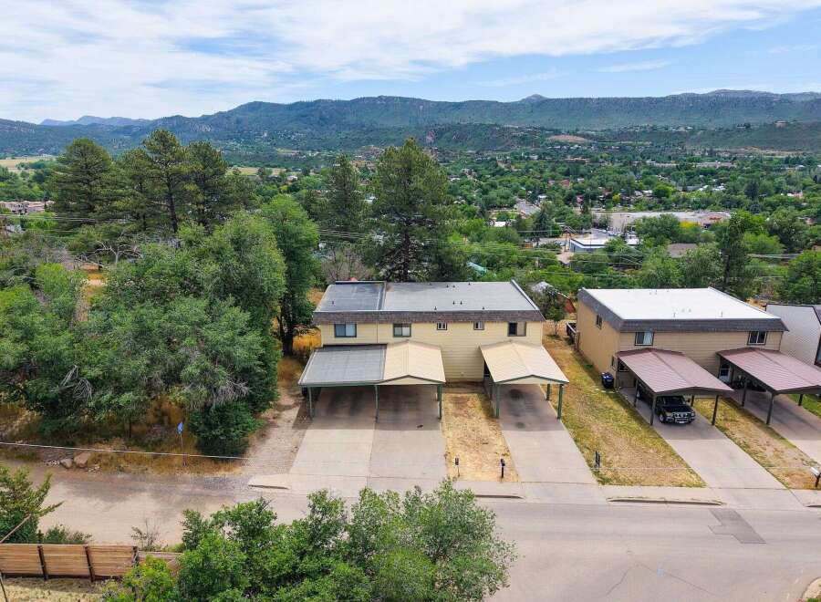 Discover this charming duplex offering comfortable living spaces and convenient covered parking.