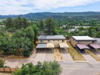 Discover this charming duplex offering comfortable living spaces and convenient covered parking.